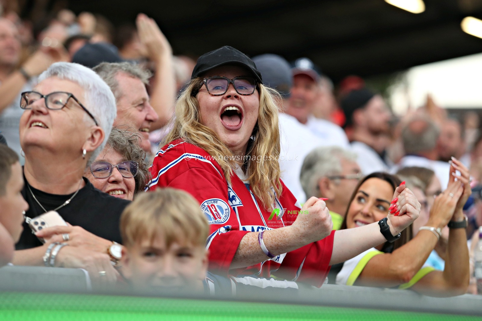 Wakefield fans celebrate the try scored by Caius Faatili of Wakefield Trinity during the Betfred Super League round 15 match Wakefield Trinity vs Wigan Warriors at DIY Kitchens Stadium, Wakefield, United Kingdom, 20th June 2025(Photo by Sam Eaden/News Images)