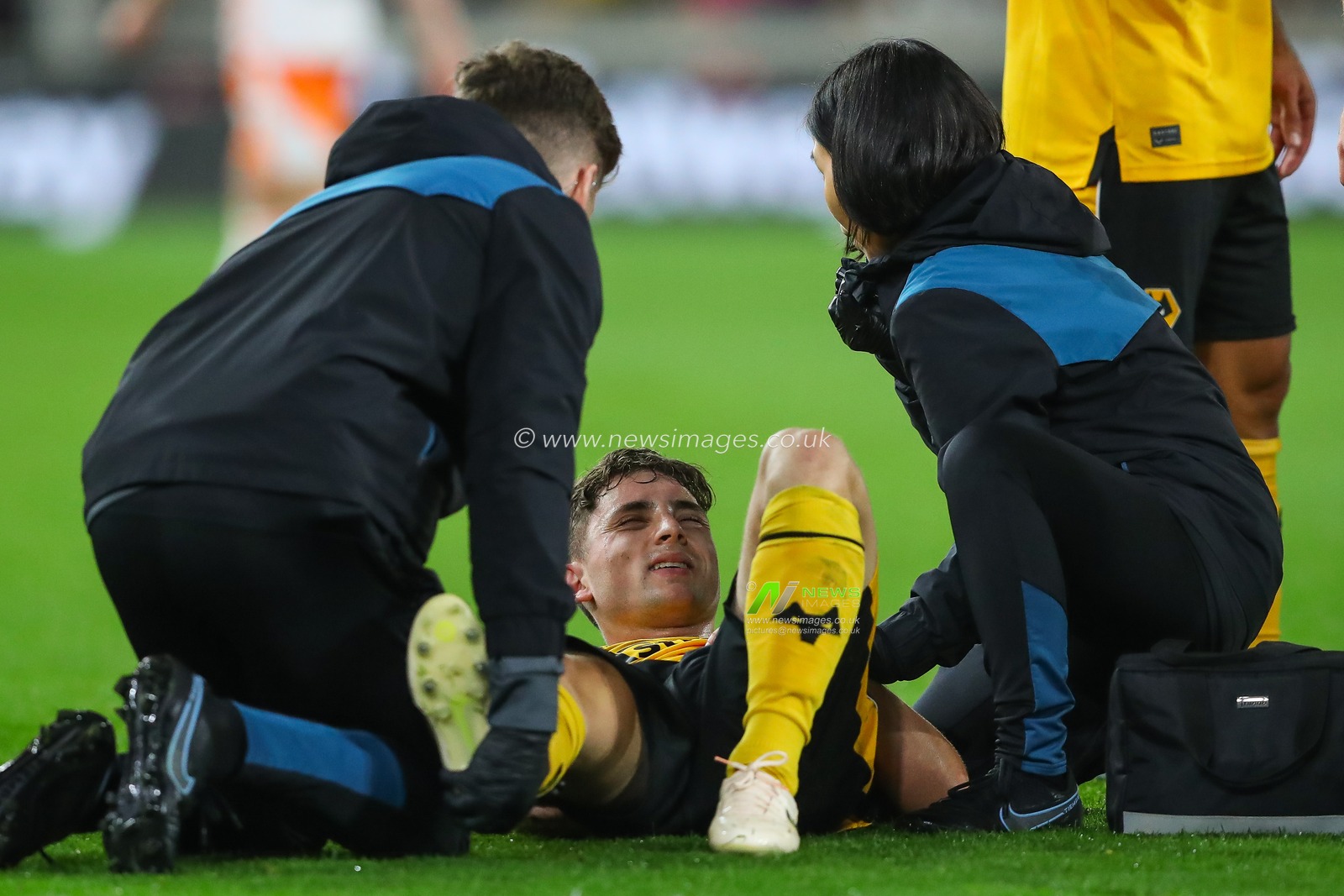 Joe Hodge #32 of Wolverhampton Wanderers receives treatment for an injury during the Carabao Cup match Wolverhampton Wanderers vs Blackpool at Molineux, Wolverhampton, United Kingdom, 29th August 2023

(Photo by Gareth Evans/News Images)