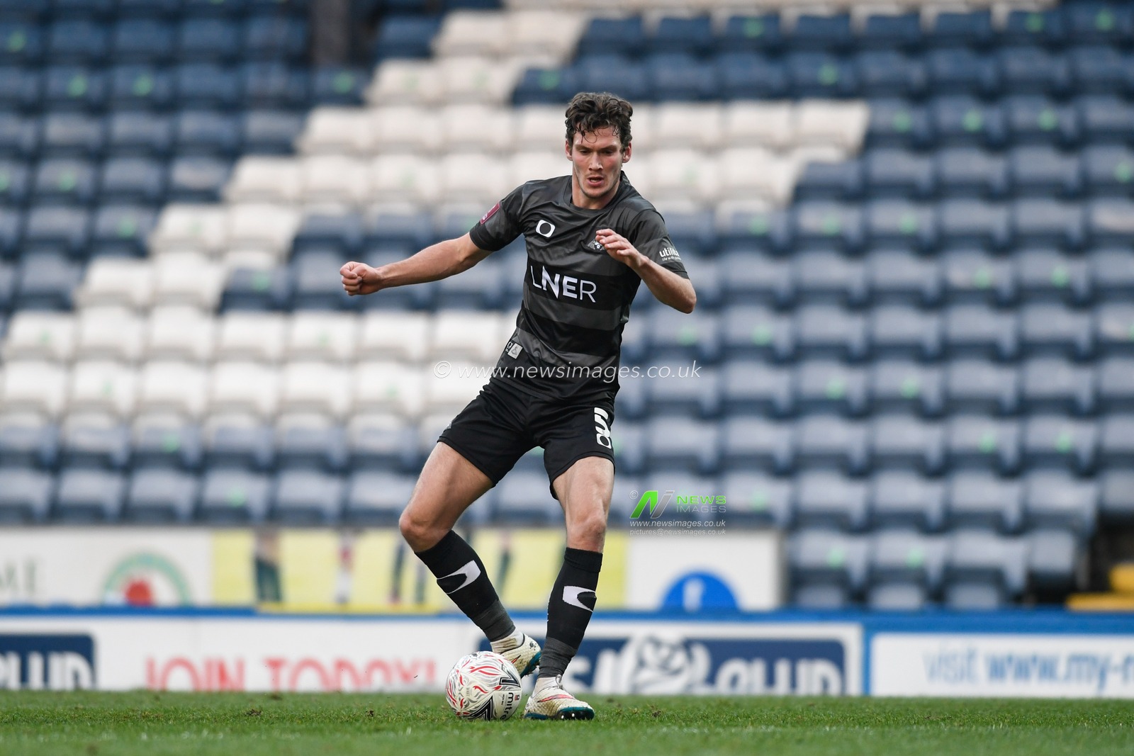Joe Wright #5 of Doncaster Rovers controls the ball