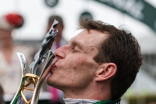 Paul Townend kisses the winners trophy as he wins the 16:00 Randox Grand National Handicap Chase on I Am Maximus during the Randox Grand National Day 2024 at Aintree Racecourse, Liverpool, United Kingdom, 13th April 2024

(Photo by Mark Cosgrove/News Images)