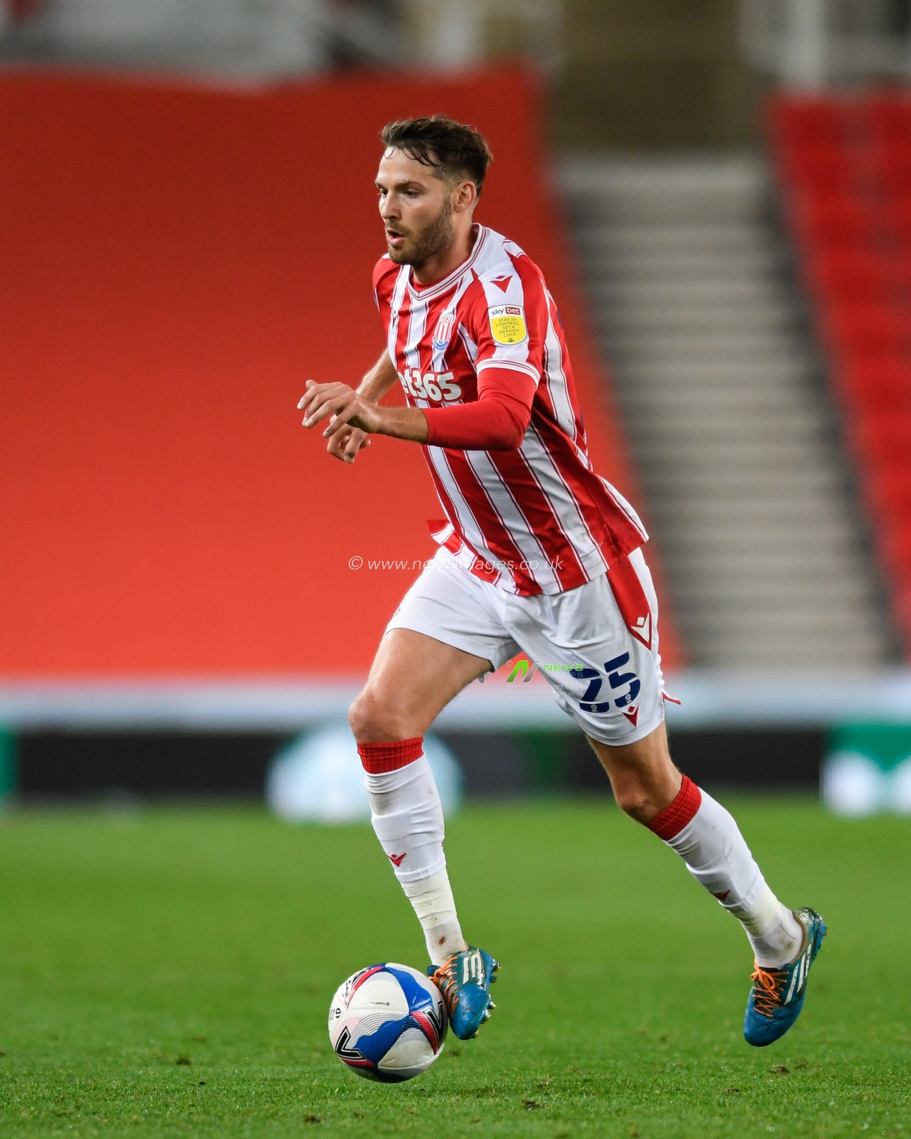 Nick Powell (25) of Stoke City runs forward with the ball