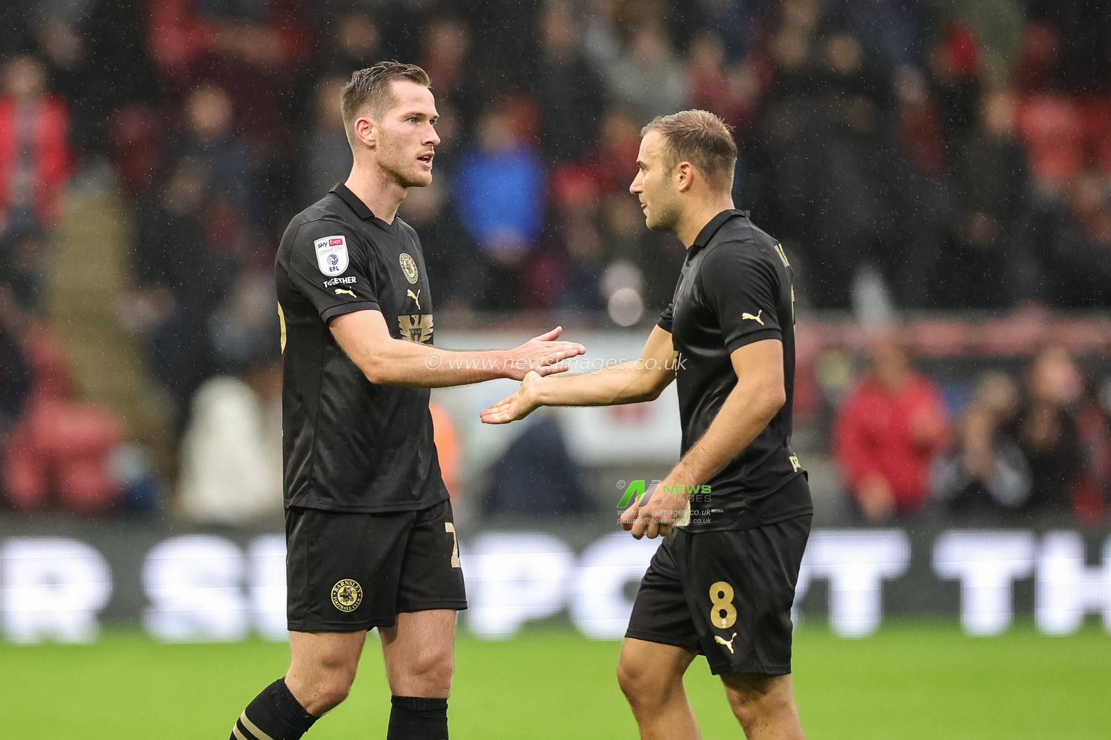Jamie McCart #26 of Barnsley shakes hands with Herbie Kane #8 of Barnsley during the Sky Bet League 1 match Leyton Orient vs Barnsley at Matchroom Stadium, London, United Kingdom, 21st October 2023

(Photo by Mark Cosgrove/News Images)