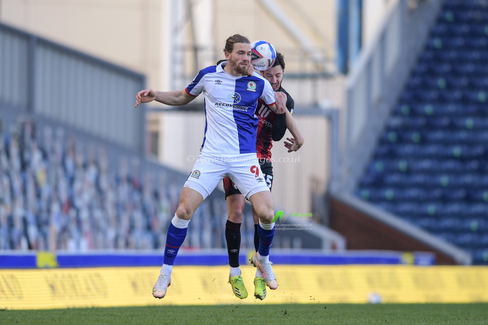 Adam Smith #15 of Bournemouth challenges Sam Gallagher #9 of Blackburn Rovers for the ball