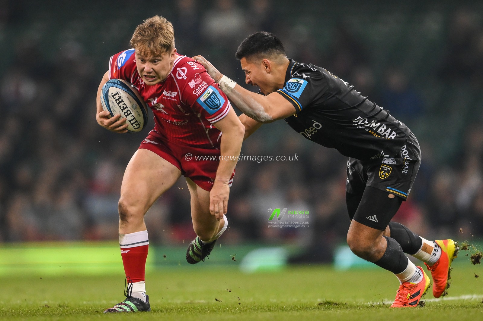 Sam Costelow of Scarlets makes a break past the tackle of Sio Tomkinson of the Dragons during the United Rugby Championship match Dragons Rugby vs Llanelli Scarlets at Principality Stadium, Cardiff, United Kingdom, 22nd April 2023

(Photo by Craig Thomas/News Images)