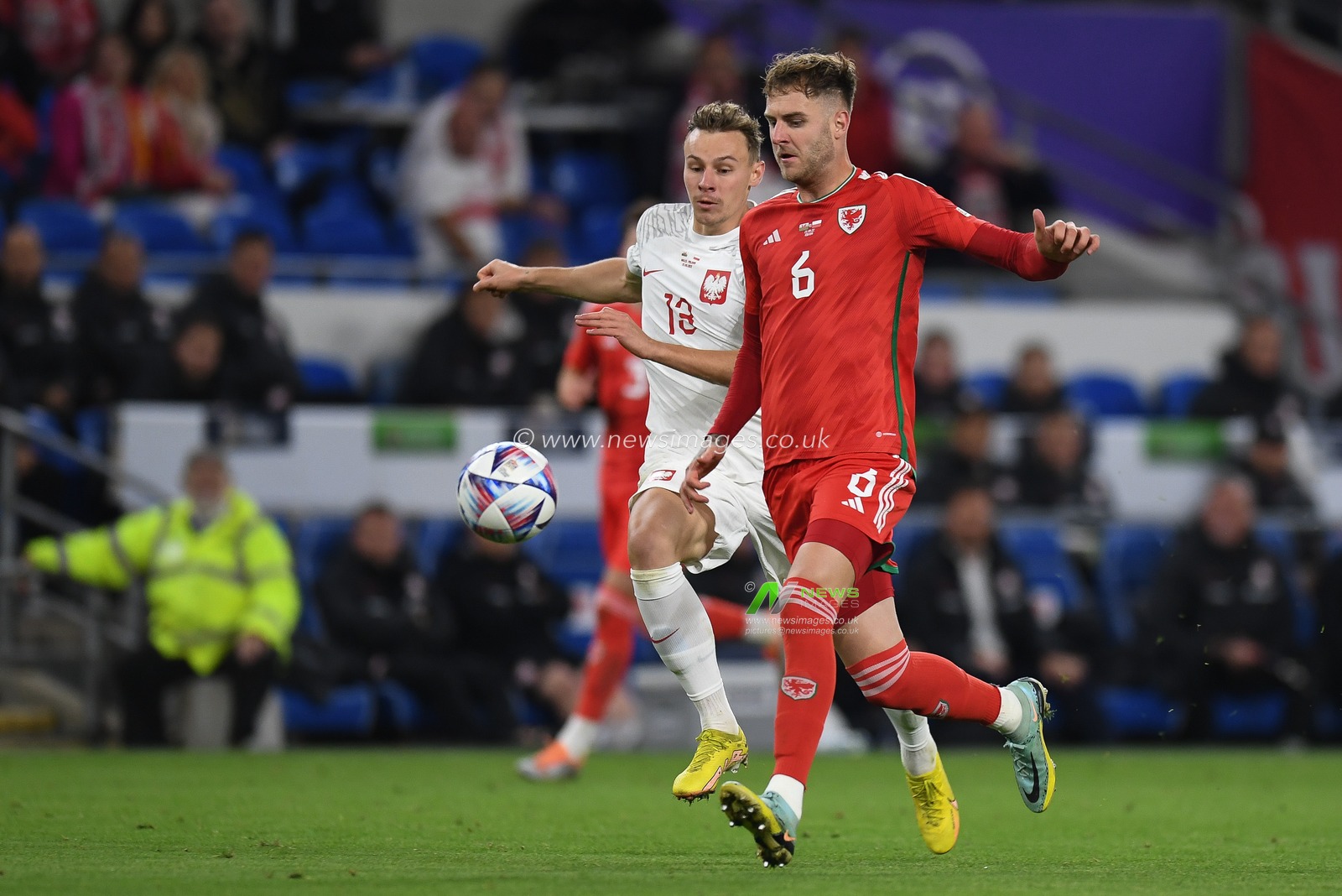 Joe Rodon of Wales Under pressure from Poland's Szymon ?urkowski during the UEFA Nations League Group A4 match between Wales vs Poland at Cardiff City Stadium, Cardiff, United Kingdom, 25th September 2022

(Photo by Mike Jones/News Images)