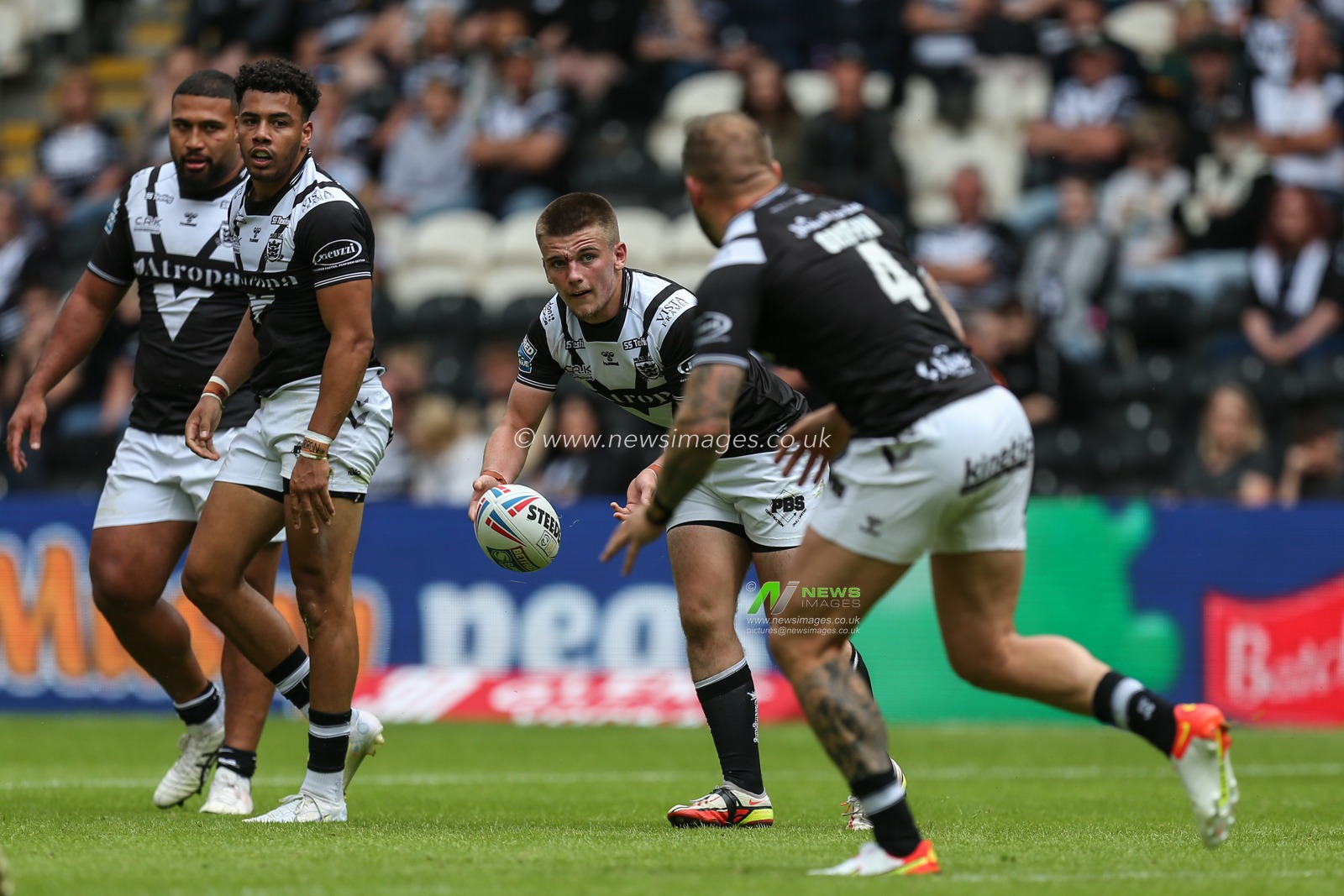 Jacob Hookem #27 of Hull FC passes to Josh Griffin #4 of Hull FC