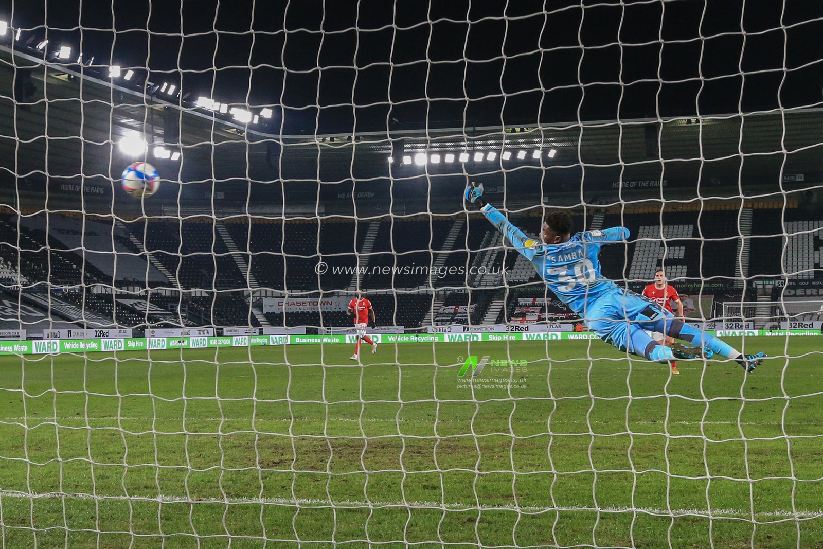 Colin Kazim-Richards #13 of Derby County scores past Brice Samba #30 of Nottingham Forest to make it 1-1