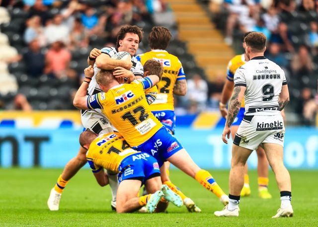 Yusuf Aydin of Hull FC is tackled James McDonnell of Leeds Rhinos  during the Betfred Super League Round 24 match Hull FC vs Leeds Rhinos at MKM Stadium, Hull, United Kingdom, 30th August 2025

(Photo by Richard Bierton/News Images)