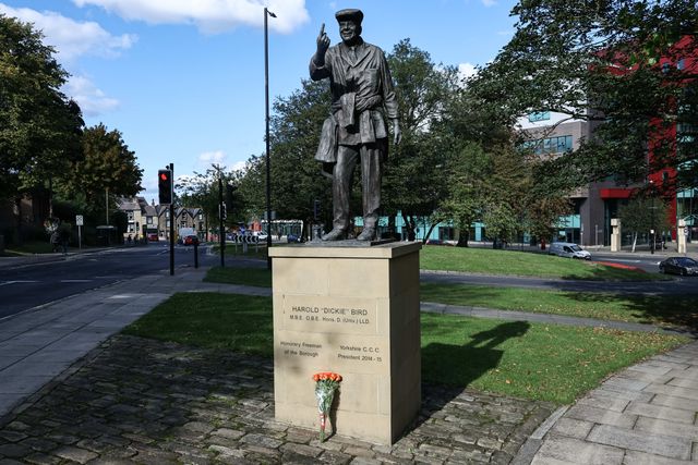 Flowers are laid at The Harold 'Dickie' Bird MBE, OBE statue after his passing today at the age of 92, Barnsley, United Kingdom, 23rd September 2025

(Photo by Mark Cosgrove/News Images)
