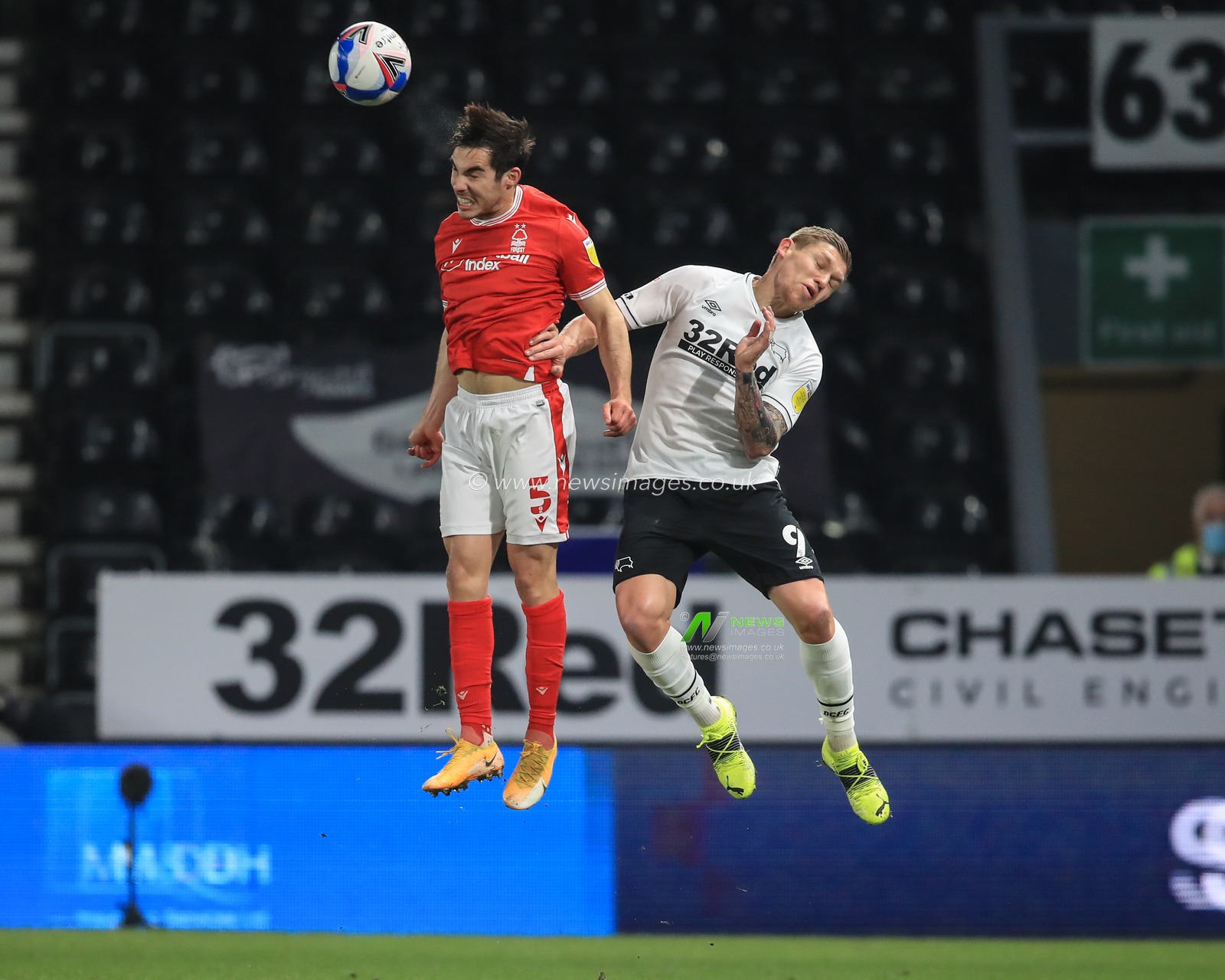 Yuri Ribeiro #5 of Nottingham Forest wins the high-ball from Martyn Waghorn #9 of Derby County