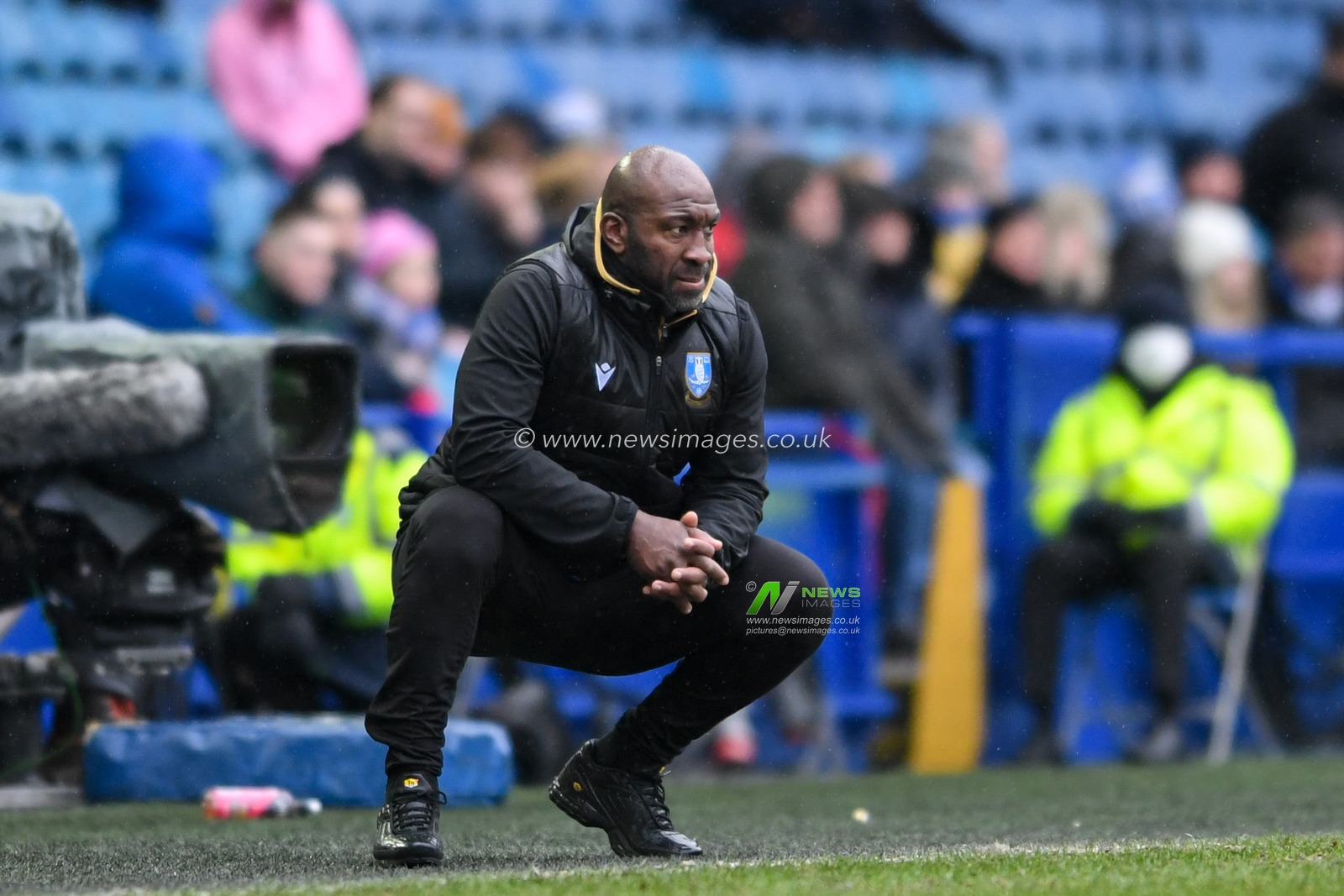 Darren Moore manager of Sheffield Wednesday watches the game from the technical area