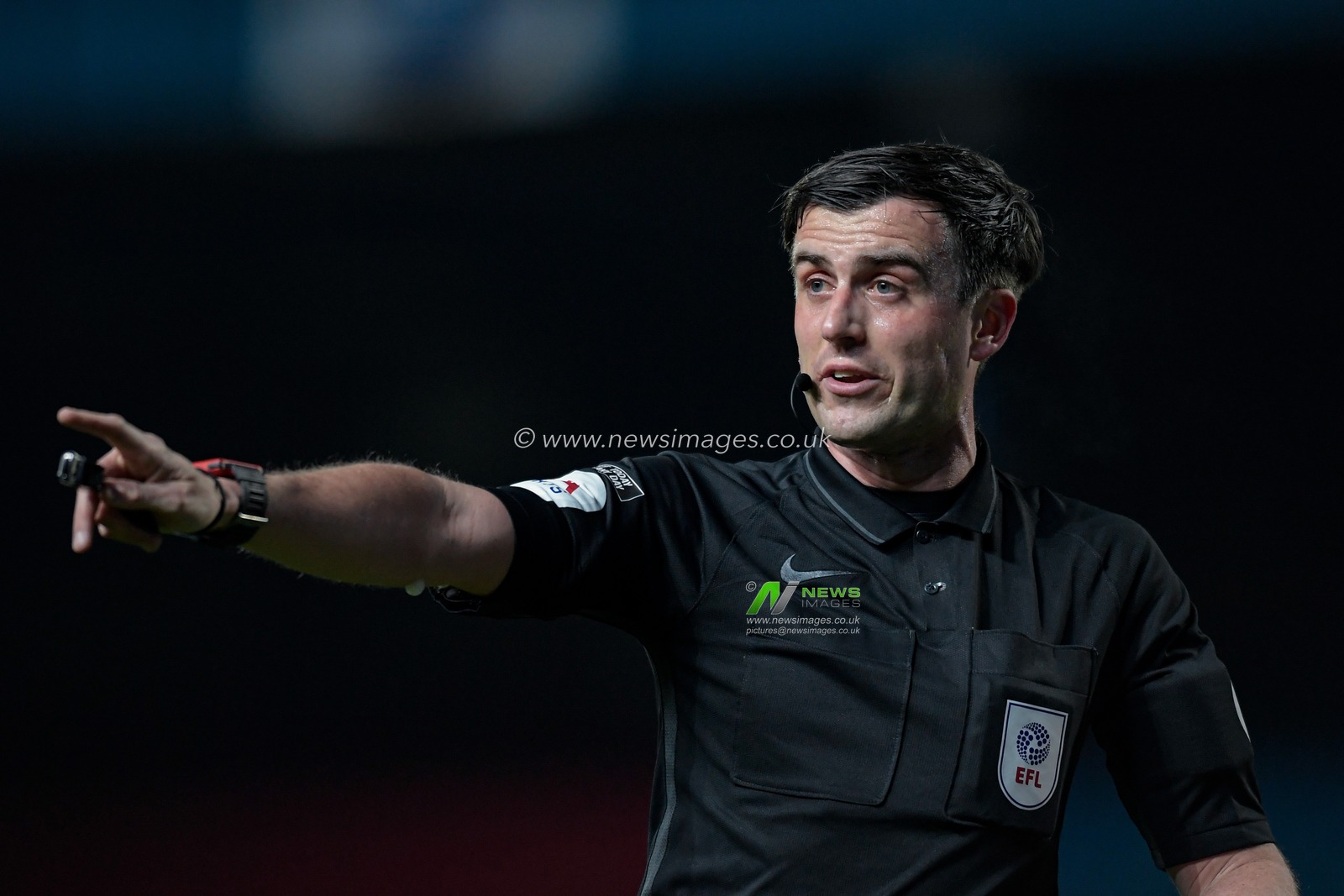 Referee Craig Hicks makes a decision