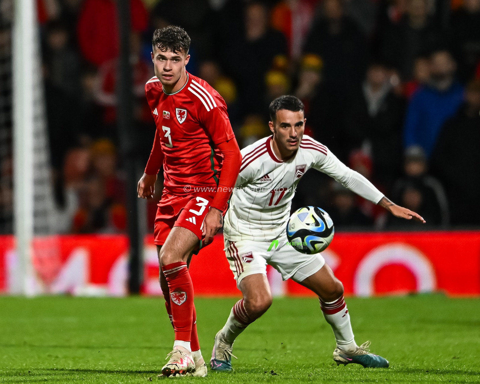 Neco Williams of Wales and Kian Ronan of Gibraltar battle for the ball during the International Friendly match Wales vs Gibraltar at SToK Cae Ras, Wrexham, United Kingdom, 11th October 2023

(Photo by Craig Thomas/News Images)