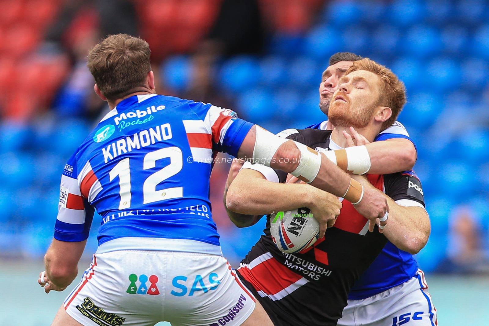 16th June 2019 ,  AJ Bell Stadium, Salford, England;  Betfred Super League, Round 18, Salford Red Devils vs Wakefield Trintiny ; Danny Brough (7) of Wakefield Trinity with a high tackle on Kris Welham (3) of Salford Red Devils 

Credit: Mark Cosgrove/News Images