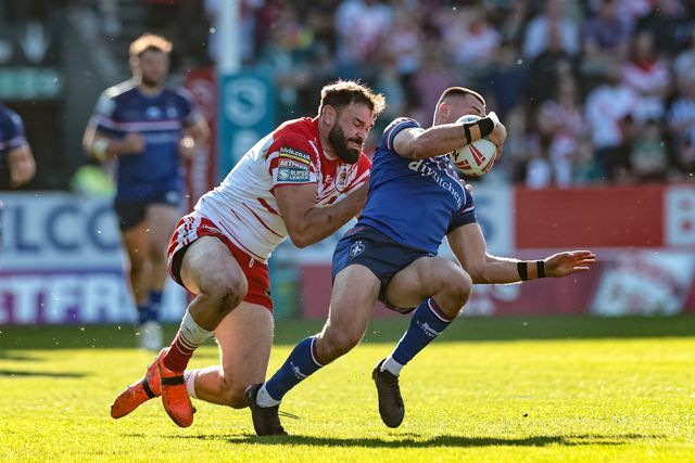 Oliver Pratt of Wakefield Trinity is tackled by Alex Walmsley of St Helens R.F.C. during the Betfred Super League round 9 match St Helens vs Wakefield Trinity at The BrewDog Stadium, St Helens, United Kingdom on 25 April 2026

(Photo by Mark Cosgrove/News Images)
