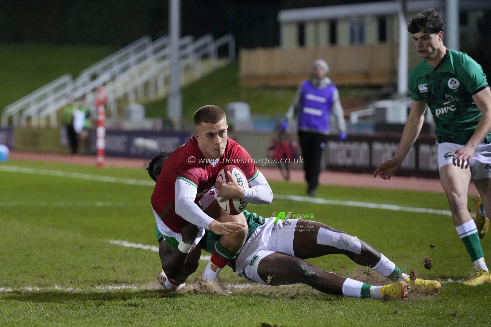 Ike Anagu #14 of Ireland U20's tackless Cameron Winnett #15 of Wales during the 2023 U20 Six Nations match Wales vs Ireland at Stadiwm CSM, Colwyn Bay, United Kingdom, 3rd February 2023

(Photo by Steve Flynn/News Images)