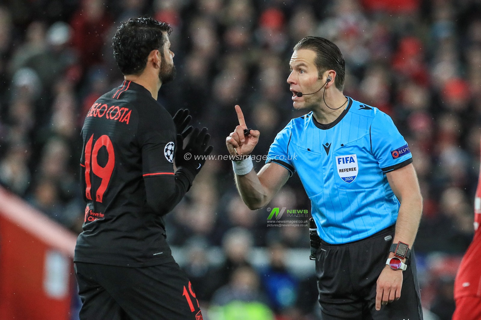 11th March 2020, Anfield, Liverpool, England; UEFA Champions League, Round of 16 Leg 2 of 2, Liverpool v Atletico Madrid : Diego Costa (19) of Atletico Madrid receives a caution from referee Danny Makkelie