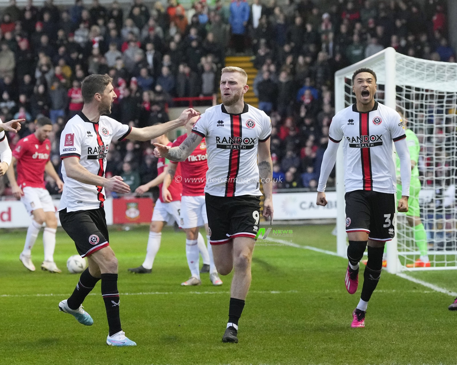 Oliver McBurnie #9 of Sheffield United celebrates scoring to make art 1-0 during the Emirates FA Cup fourth round match Wrexham vs Sheffield United at The Racecourse Ground, Wrexham, United Kingdom, 29th January 2023

(Photo by Steve Flynn/News Images)