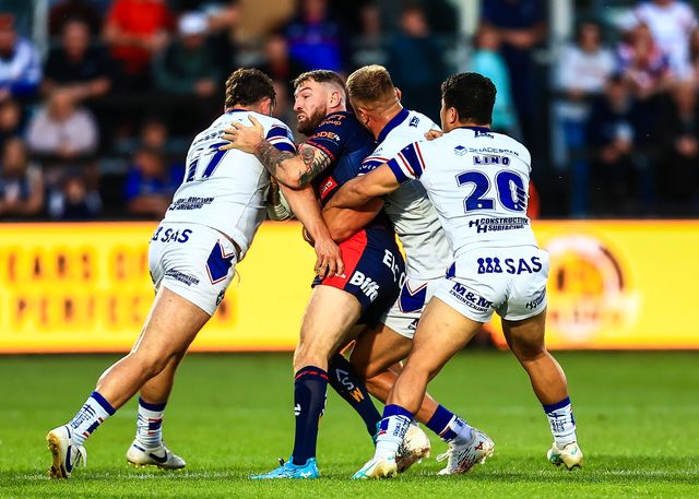 Daryl Clark of St. Helens is tackled during the Betfred Super League round 21 match Wakefield Trinity vs St Helens at DIY Kitchens Stadium, Wakefield, United Kingdom, 8th August 2025

(Photo by Richard Bierton/News Images)
