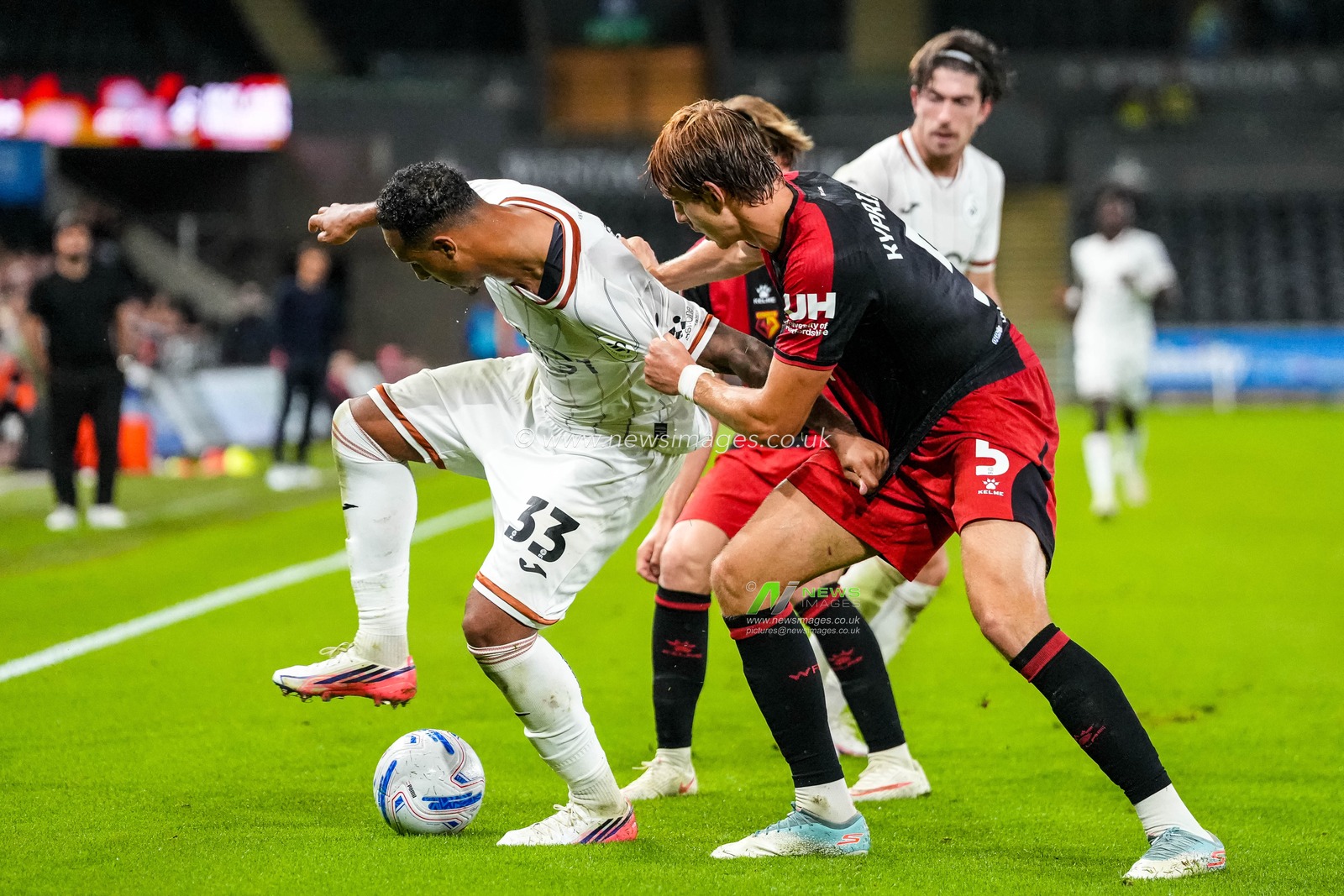 Adam Idah of Swansea City under pressure from Hector Kyprianou of Watford during the Sky Bet Championship match Swansea City vs Watford at Swansea.com Stadium, Swansea, United Kingdom on 01 September 2026

(Photo by Andrew Lewis/News Images)