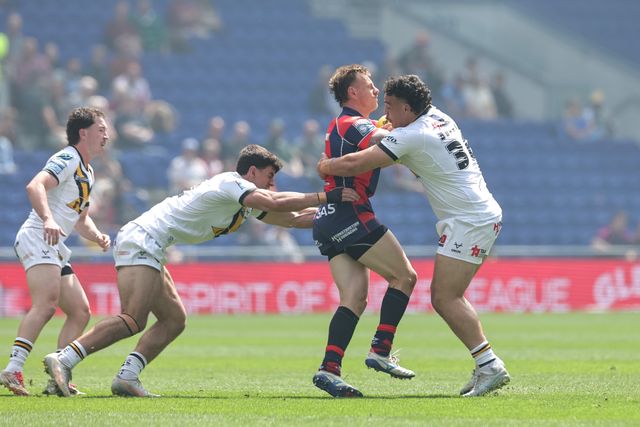 Tom Johnstone of Wakefield Trinity is tackled by Tyler Dupree of Castleford Tigers during the Betfred Super League Magic Weekend match Wakefield Trinity vs Castleford Tigers at Hill Dickinson Stadium, Liverpool, United Kingdom on 05 July 2026

(Photo by Mark Cosgrove/News Images)