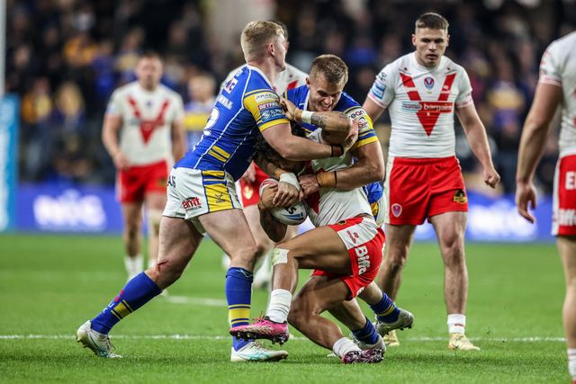 Tristan Sailor of St. Helens is tackled by Cooper Jenkins of Leeds Rhinos during the Betfred Super League play-off Eliminator 1 match Leeds Rhinos vs St Helens at Headingley Stadium, Leeds, United Kingdom, 27th September 2025

(Photo by Alfie Cosgrove/News Images)