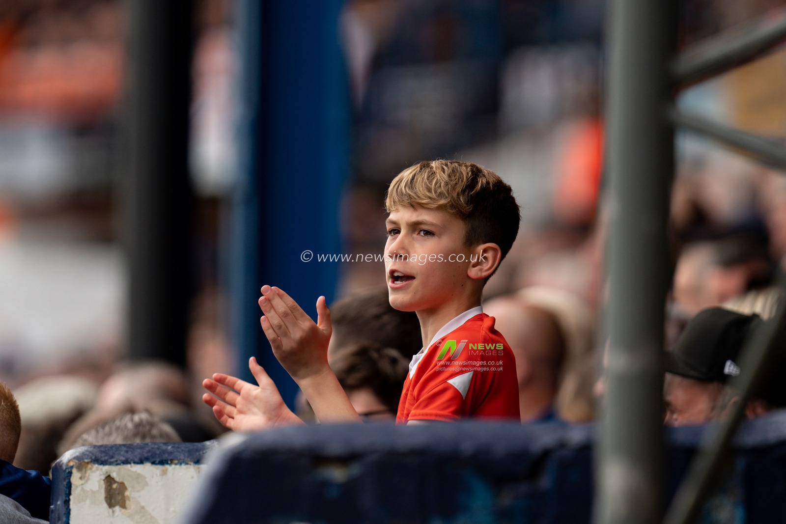Young fan urges his players on