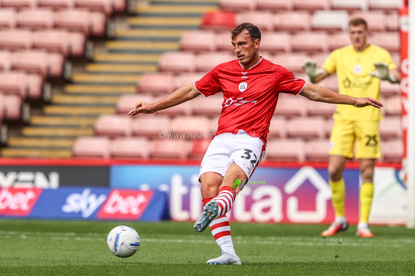 Josh Earl of Barnsley passes the ball during the Sky Bet League One match Barnsley vs Bromley at Oakwell, Barnsley, United Kingdom on 15 August 2026

(Photo by Alfie Cosgrove/News Images)