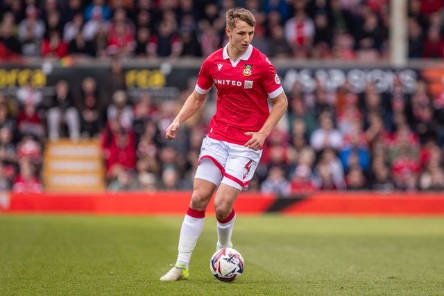 Wrexham's Max Cleworth carries the ball during the Sky Bet League 1 match Wrexham vs Stockport County at SToK Cae Ras, Wrexham, United Kingdom, 22nd March 2025

(Photo by Nik Mesney/News Images)