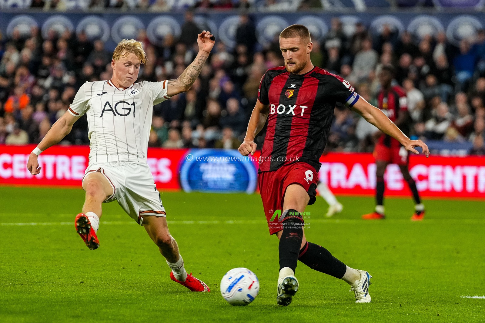 Mattie Pollock of Watford under pressure from Melker Widell of Swansea City during the Sky Bet Championship match Swansea City vs Watford at Swansea.com Stadium, Swansea, United Kingdom on 01 September 2026

(Photo by Andrew Lewis/News Images)