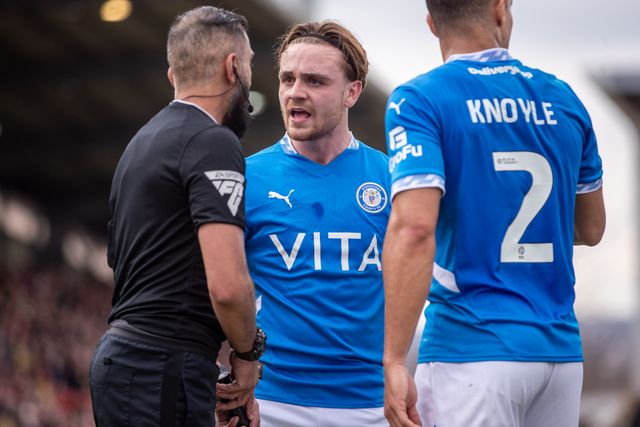 Stockport County's Lewis Bate talks to the Assistant Referee during the Sky Bet League 1 match Wrexham vs Stockport County at SToK Cae Ras, Wrexham, United Kingdom, 22nd March 2025

(Photo by Nik Mesney/News Images)