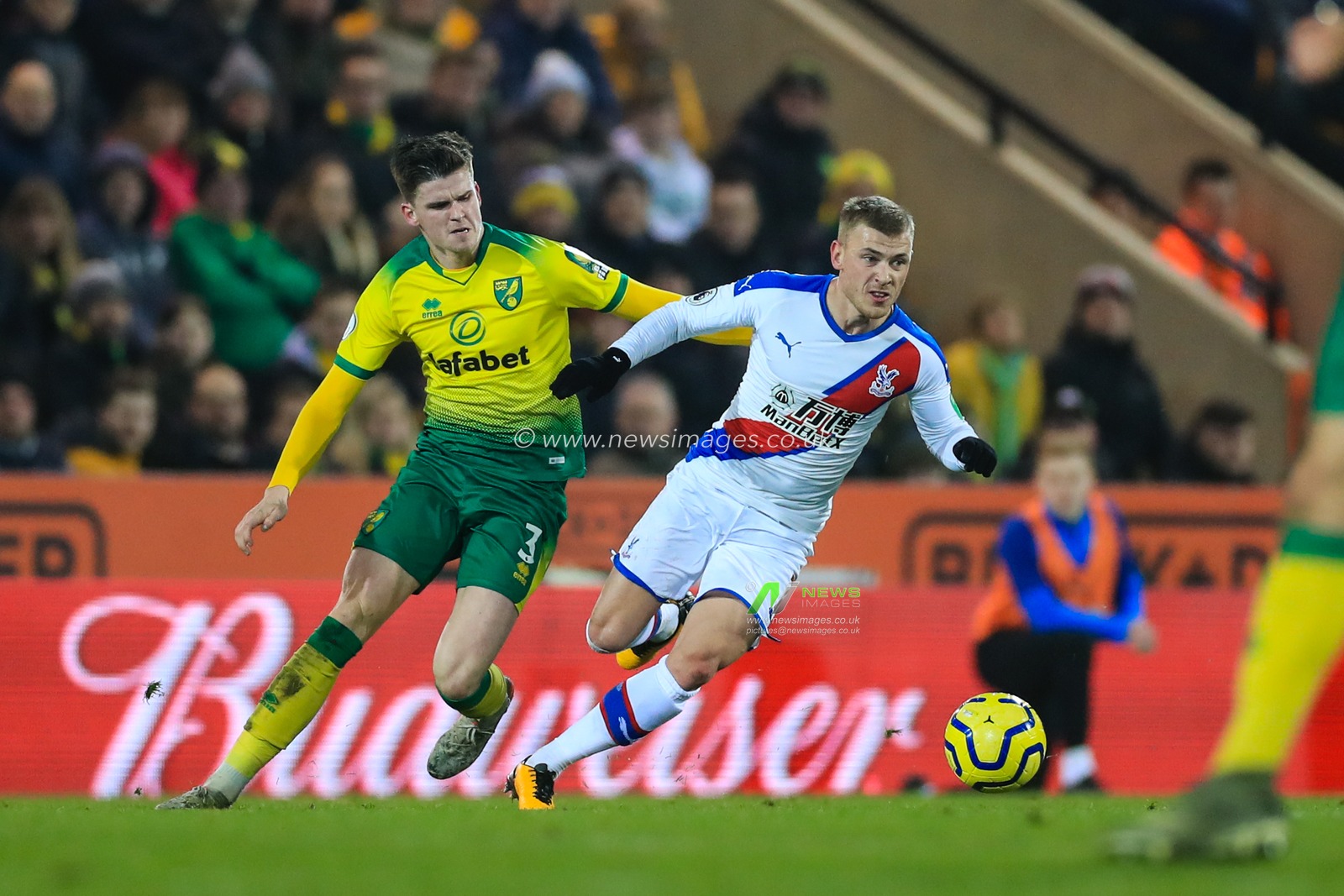 1st January 2020, Carrow Road, Norwich, England; Premier League, Norwich City v Crystal Palace : Max Meyer (7) of Crystal Palace is tracked by Sam Byram (03) of Norwich City

Credit: Georgie Kerr/News Images