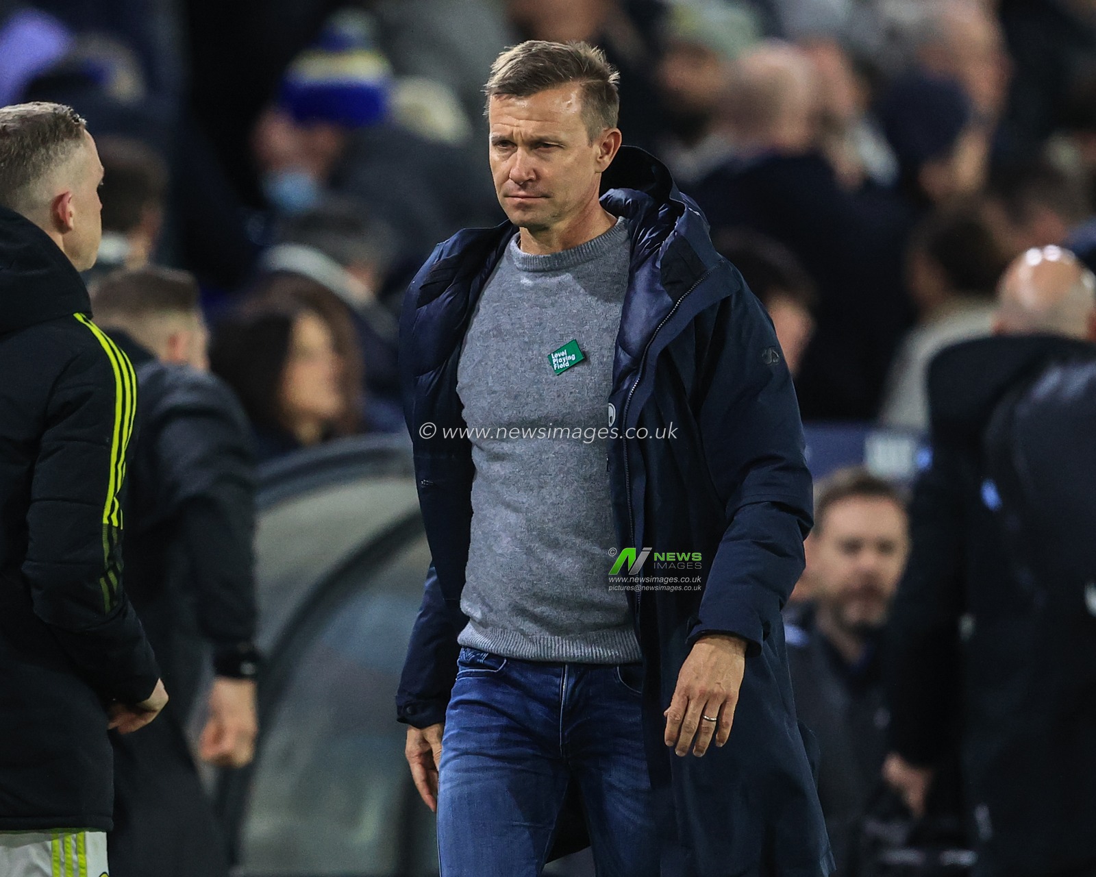 A dejected Jesse Marsch manager of Leeds United heads back to the dressing room after losing 0-3