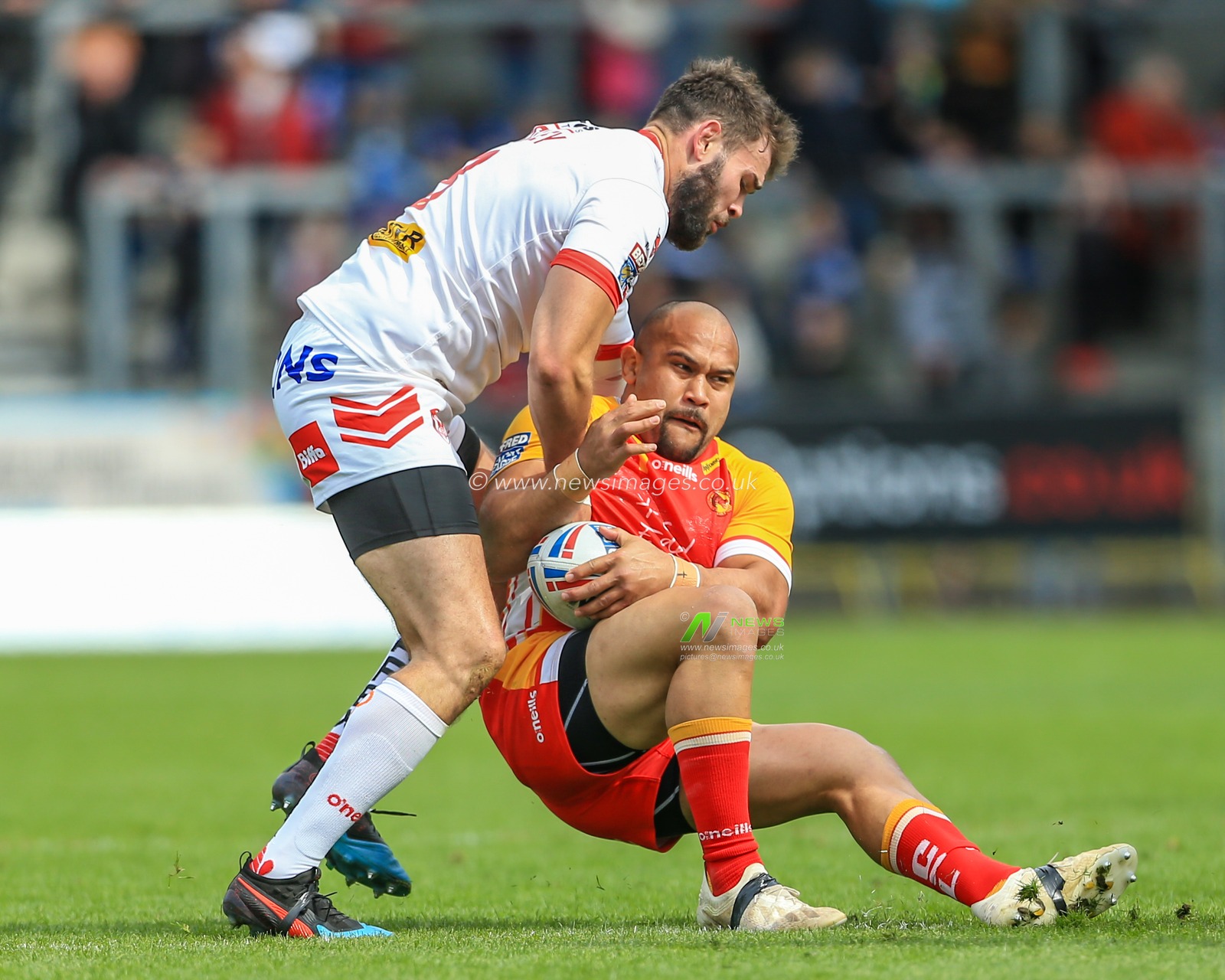 28th April 2019 , Totally Wicked Stadium, St Helens, England;  Betfred Super League, Round 13, St Helens vs Catalans Dragons ; Sam Moa (10) of Catalans Dragons is tackled by Alex Walmsley (8) of St Helens 

Credit: Mark Cosgrove/News Images