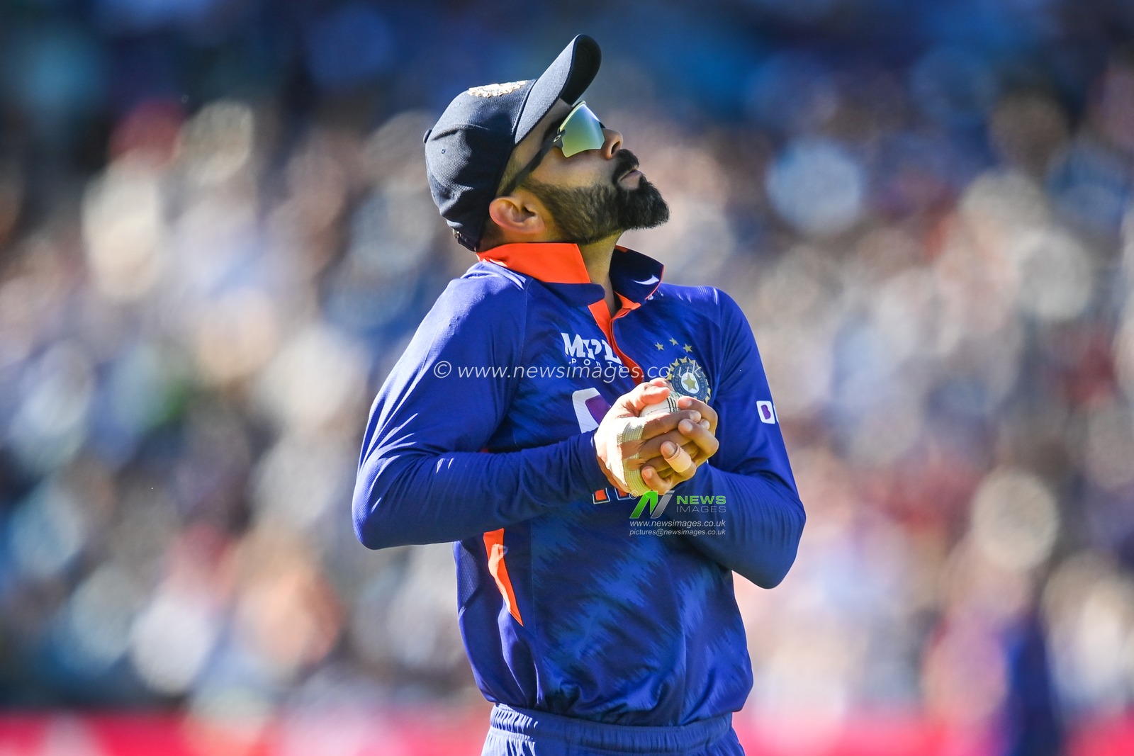 Virat Kohli of India catches Richard Gleeson of England off the bowling of Bhuvneshwar Kumar of India