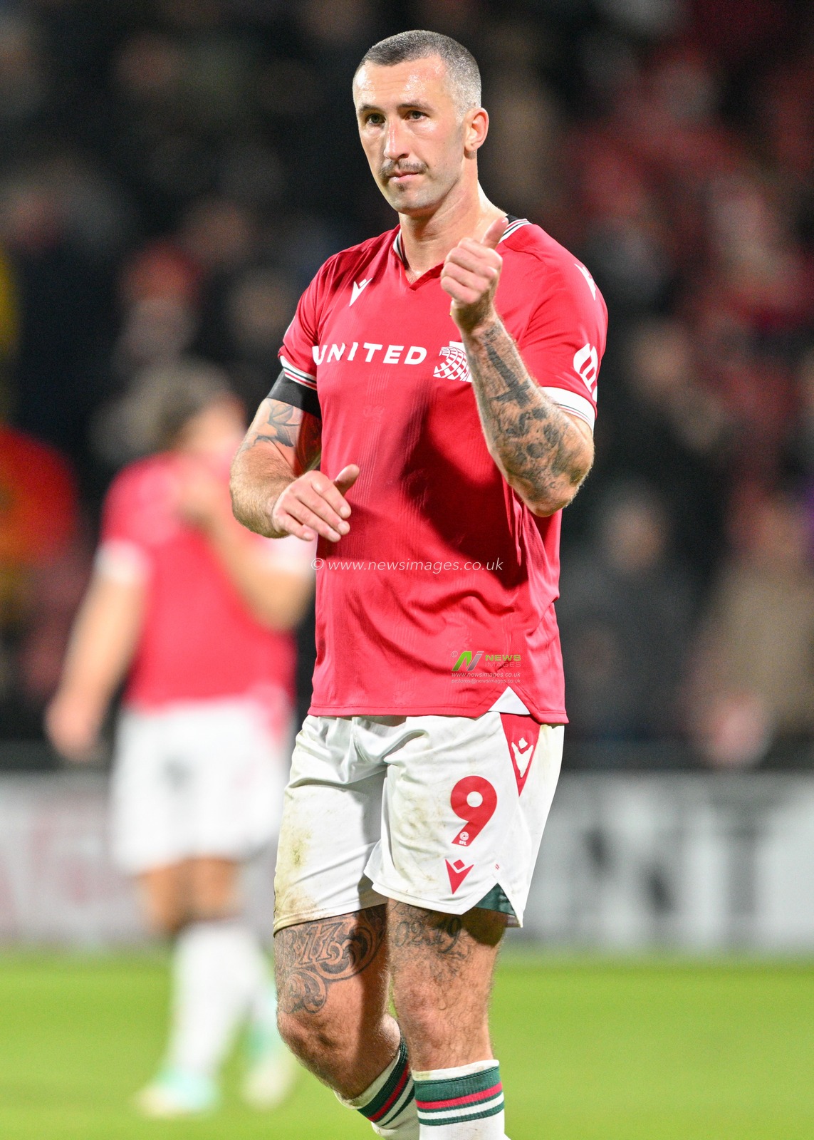 Ollie Palmer 9# of Wrexham Association Football Club celebrates the full time result, during the Sky Bet League 2 match Wrexham vs Gillingham at SToK Cae Ras, Wrexham, United Kingdom, 11th November 2023

(Photo by Cody Froggatt/News Images)
