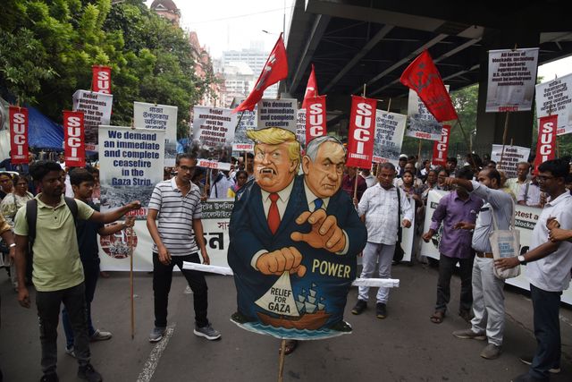 Activists of Social Unity Center of India (SUCI) hold placards and an effigy of US President Donald Trump and Israel's Prime Minister Benjamin Netanyahu during a protest against Western policy in the Israel-Hamas conflict, near US Embassy in Kolkata, Eastern India, 07 October 2025.Photo by Debajyoti Chakraborty.(Photo: Debajyoti Chakraborty/News Images)