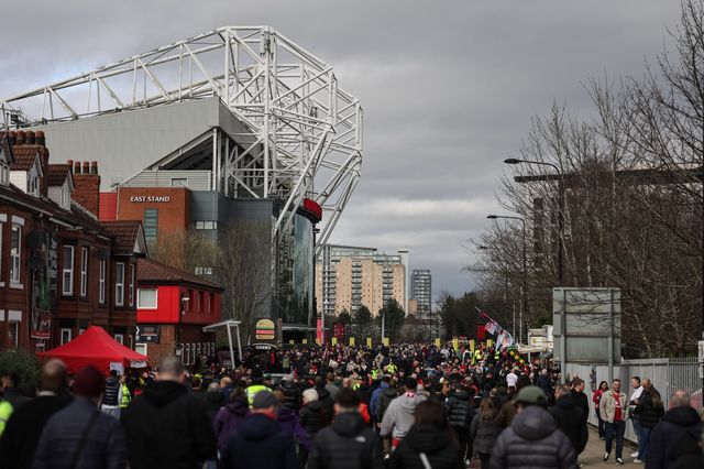 Manchester United fans make their way to Old Trafford during the Premier League match Manchester United vs Crystal Palace at Old Trafford, Manchester, United Kingdom on 01 March 2026

(Photo by Mark Cosgrove/News Images)