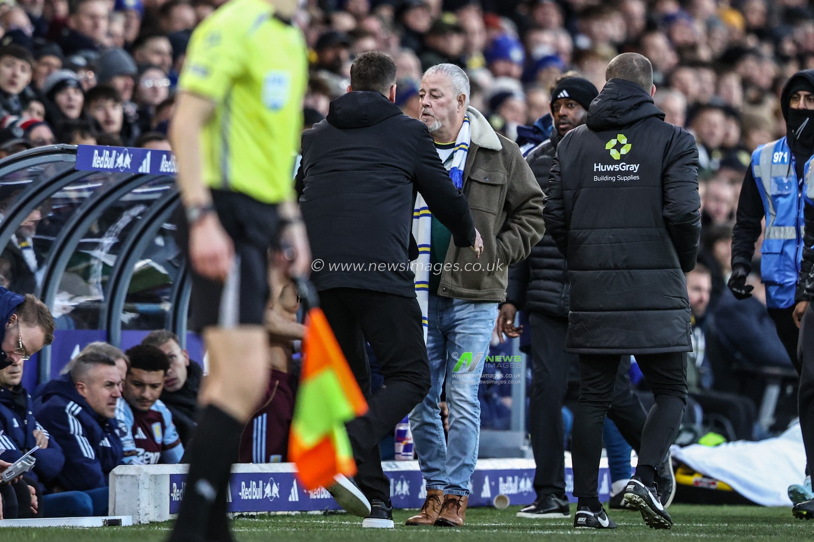 A fan is removed by security after walking onto the dugouts during the Premier League match Leeds United vs Aston Villa at Elland Road, Leeds, United Kingdom, 23rd November 2025

(Photo by Alfie Cosgrove/News Images)

*** GER AUT SUI OUT ***