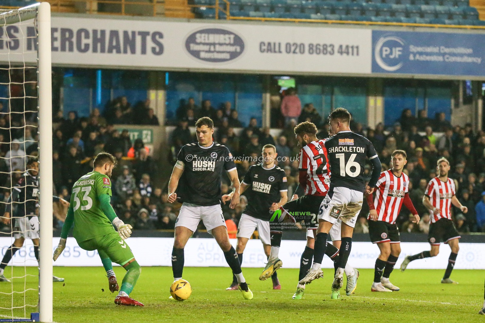 Jayden Bogle #20 of Sheffield United  has a shot saved by Bartosz BiaÅ‚kowski #33 of Millwall during the Emirates FA Cup Third Round match Millwall vs Sheffield United at The Den, London, United Kingdom, 7th January 2023

(Photo by Arron Gent/News Images)