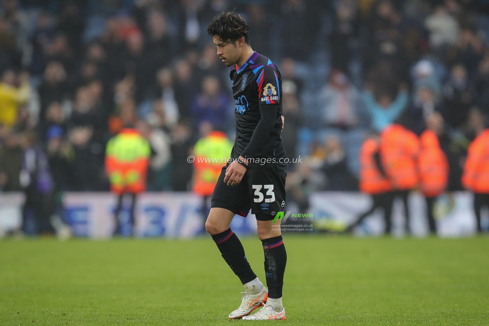 Yuta Nakayama #33 of Huddersfield Town walks off the field after the Sky Bet Championship match Leeds United vs Huddersfield Town at Elland Road, Leeds, United Kingdom, 28th October 2023

(Photo by James Heaton/News Images)