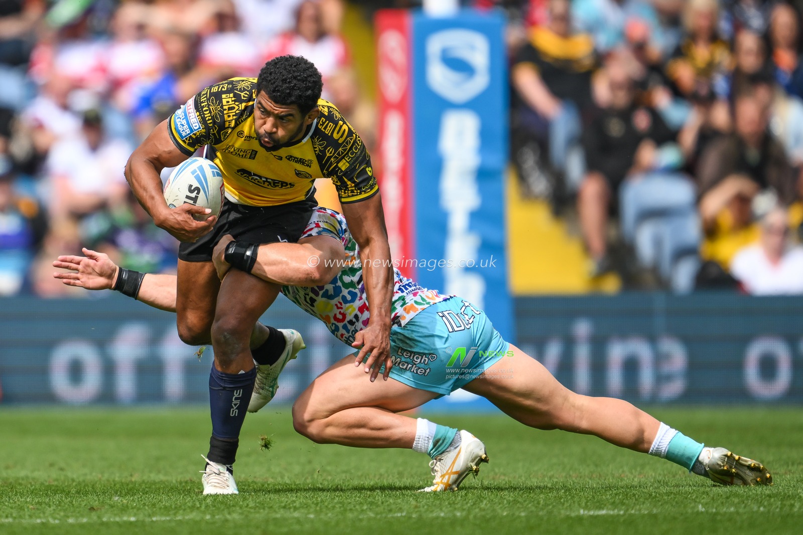 Kallum Watkins of Salford Red Devils  is tackled by Kai Oâ€™Donnell of Leigh Leopards during the Magic Weekend match Leigh Leopards vs Salford Red Devils at Elland Road, Leeds, United Kingdom, 18th August 2024

(Photo by Craig Thomas/News Images)