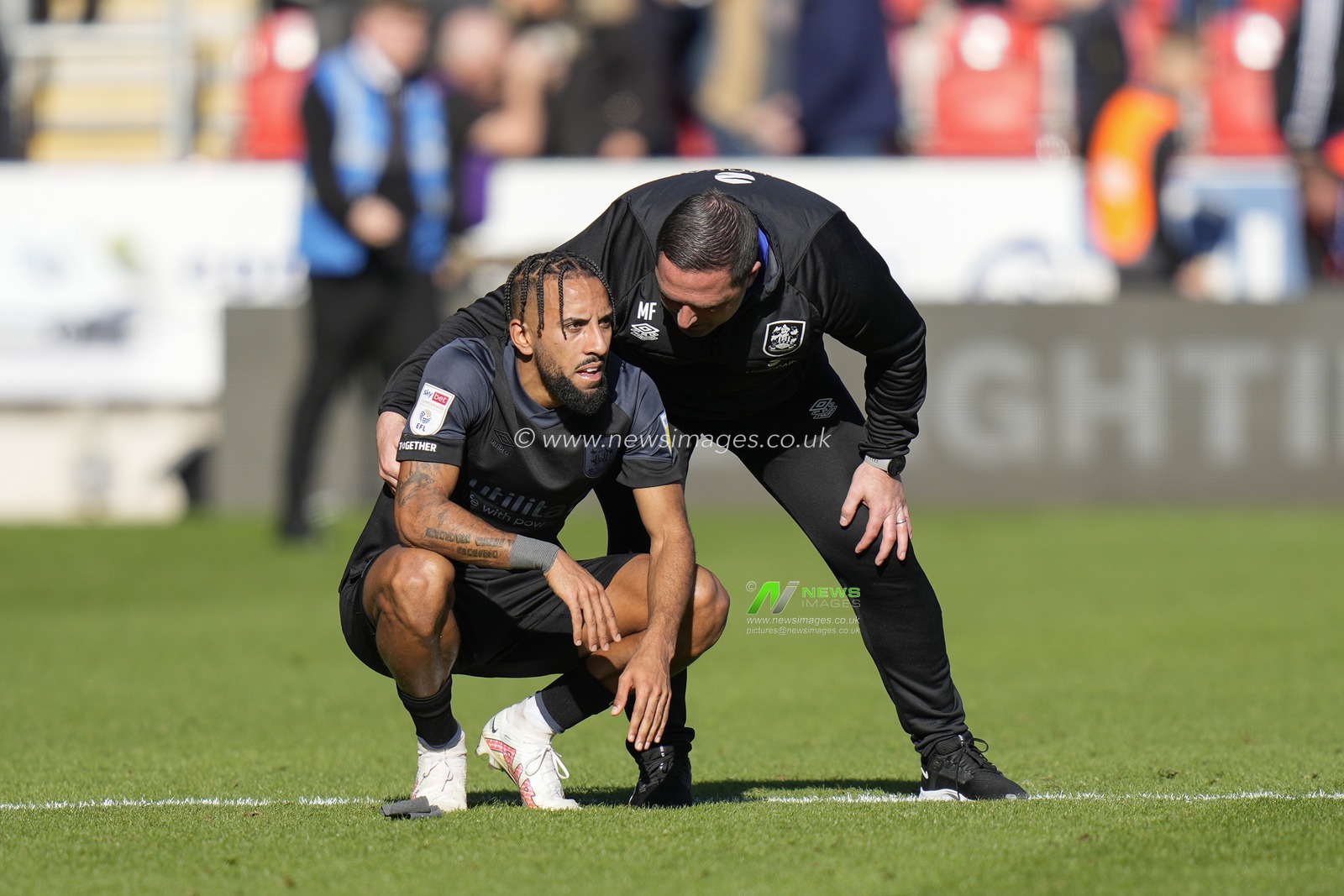 Mark Fotheringham manager of Huddersfield Town consoles Sorba Thomas after their sides 1-2 defeat during the Sky Bet Championship match Rotherham United vs Huddersfield Town at AESSEAL New York Stadium, Rotherham, United Kingdom, 15th October 2022

(Photo by Steve Flynn/News Images)