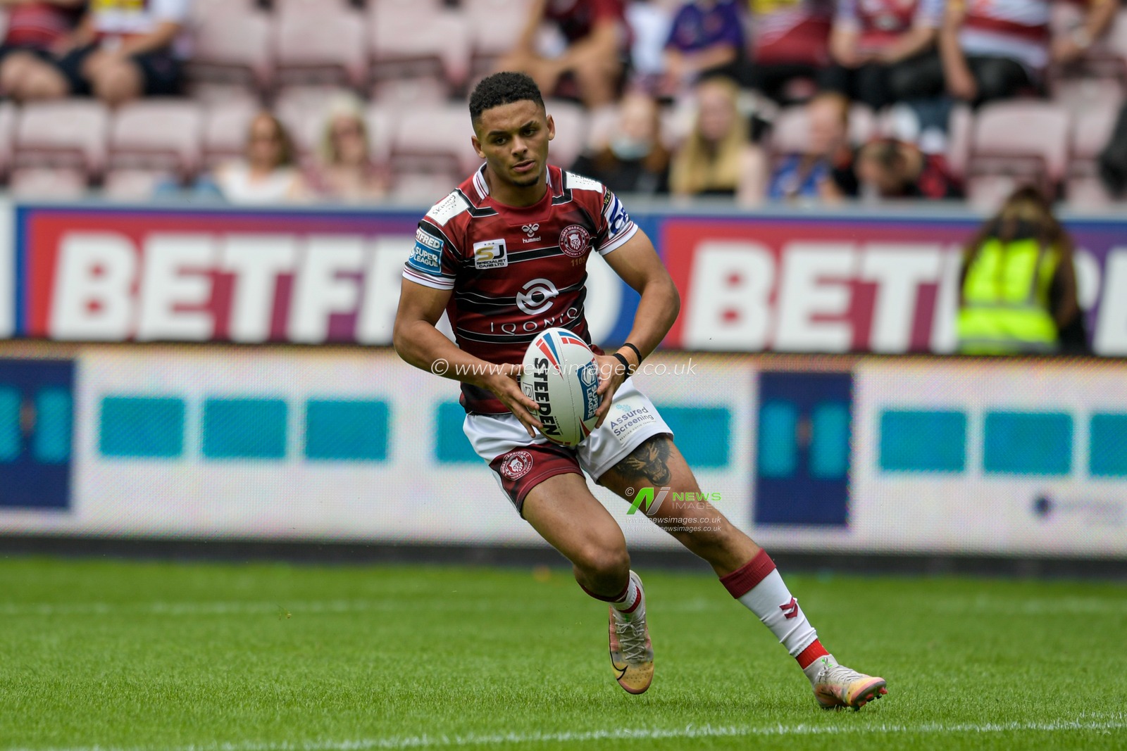 Umyla Hanley (30) of Wigan Warriors with the ball