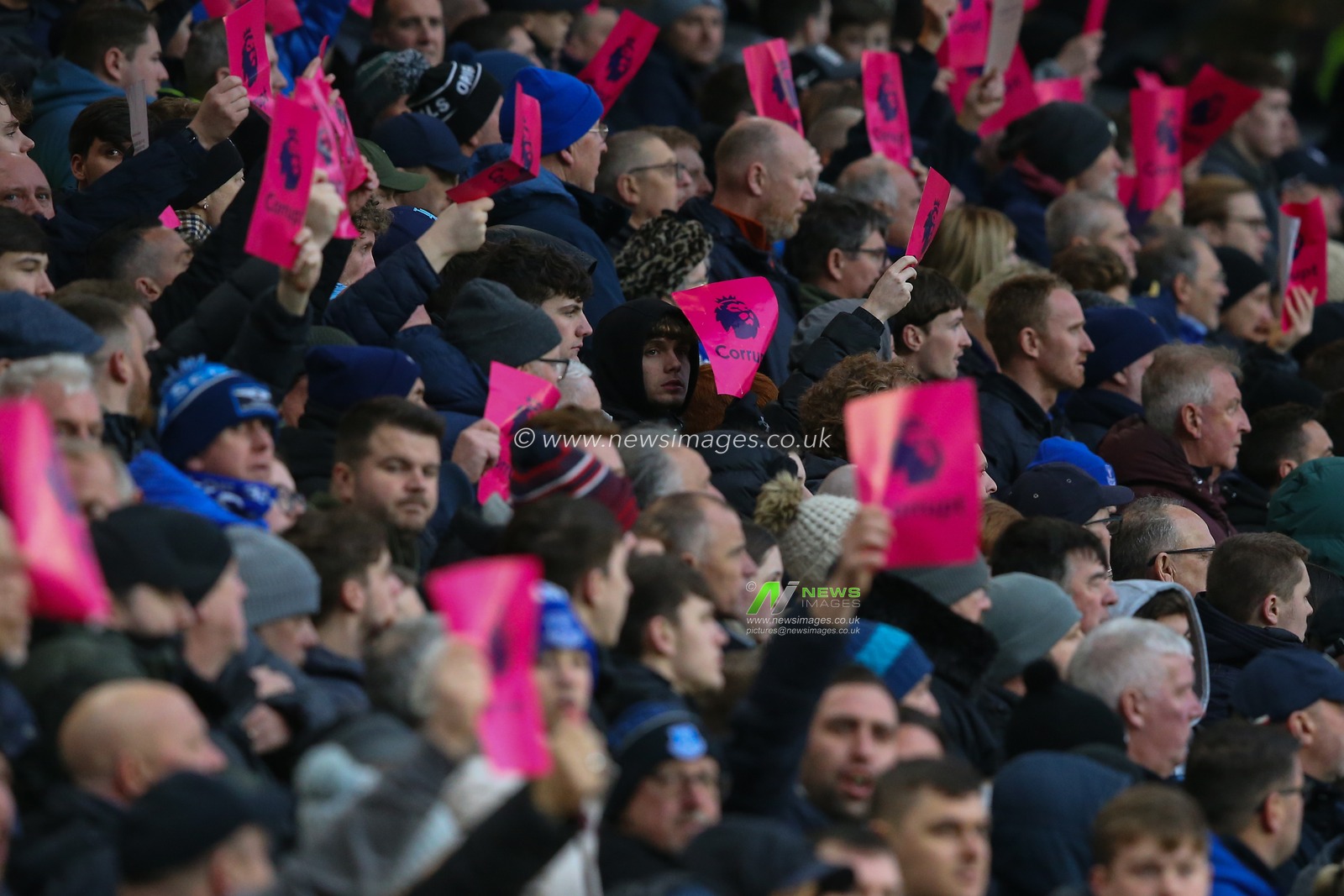 Everton fans hold up Premier League Corrupt signs during the Premier League match Wolverhampton Wanderers vs Everton at Molineux, Wolverhampton, United Kingdom, 30th December 2023

(Photo by Gareth Evans/News Images)