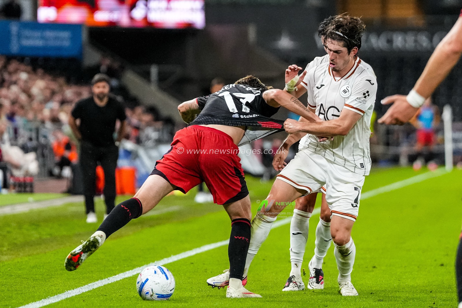 Josh Key of Swansea City grabs hold of Iker Bravo of Watford during the Sky Bet Championship match Swansea City vs Watford at Swansea.com Stadium, Swansea, United Kingdom on 01 September 2026

(Photo by Andrew Lewis/News Images)