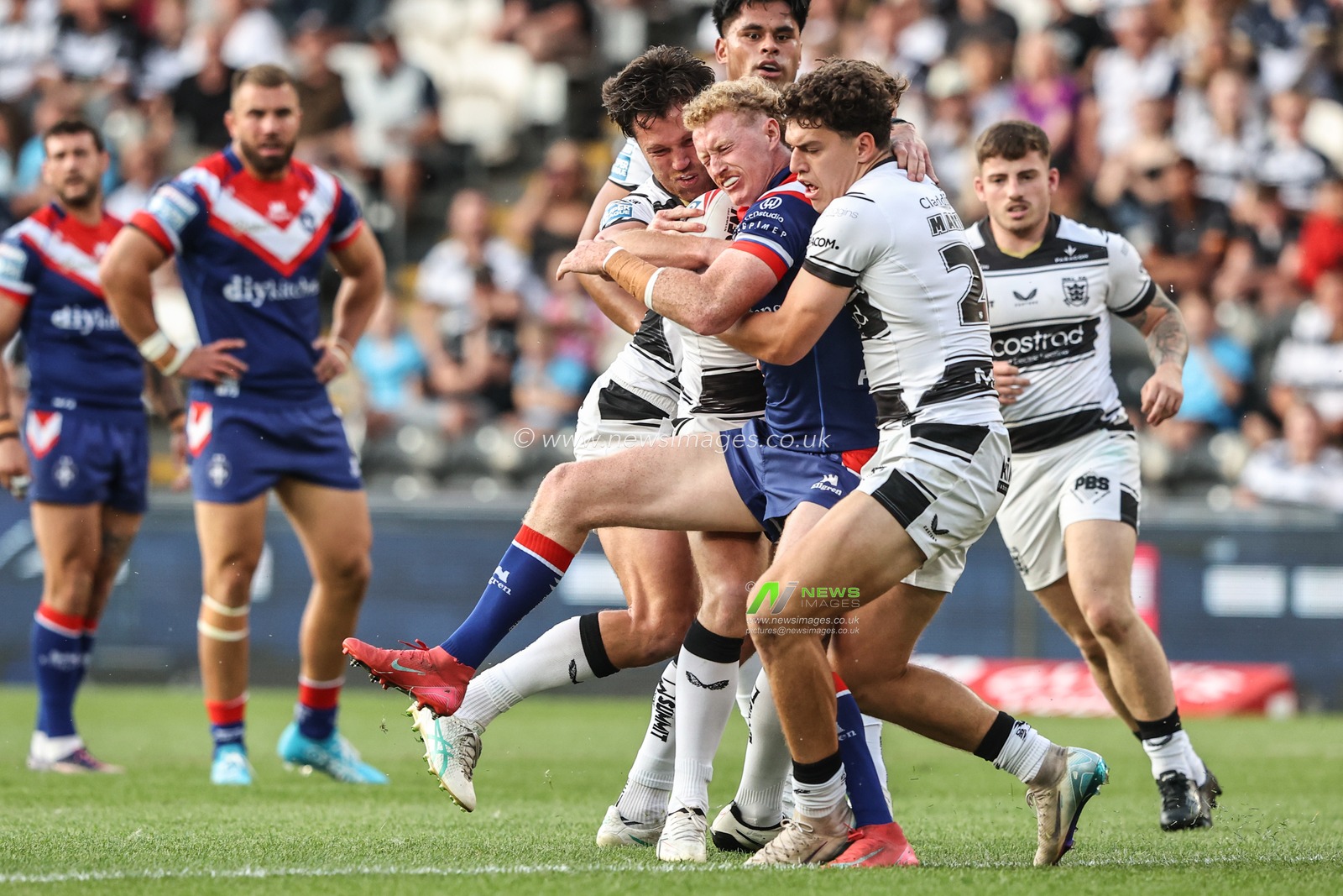 Lachlan Walmsley of Wakefield Trinity is tackled by Lewis Martin of Hull FC during the Betfred Super League round 18 match Hull FC vs Wakefield Trinity at MKM Stadium, Hull, United Kingdom, 10th July 2025

(Photo by Alfie Cosgrove/News Images)