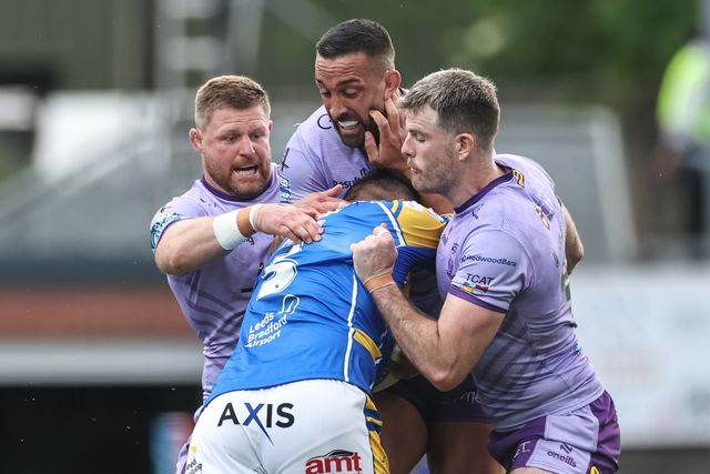 Ryan Hall of Leeds Rhinos is tackled by Luke Yates of Warrington Wolves Paul Vaughan of Warrington Wolves and Lachlan Fitzgibbon of Warrington Wolves during the Betfred Super League Round 14 Leeds Rhinos v Warrington Wolves at Headingley Stadium, Leeds, United Kingdom, 14th June 2025

(Photo by Mark Cosgrove/News Images)