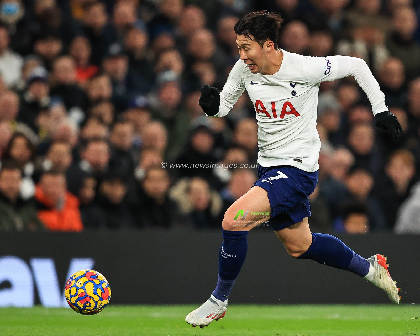 Son Heung-Min #7 of Tottenham Hotspur breaks away from Diego Llorente #14 of Leeds United