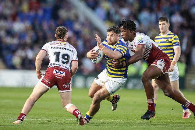 Joe Philbin of Warrington Wolves is tackled by Junior Nsemba of Wigan Warriors during the Betfred Super League round 9 match Warrington Wolves vs Wigan Warriors at The Halliwell Jones Stadium, Warrington, United Kingdom on 24 April 2026

(Photo by Mark Cosgrove/News Images)